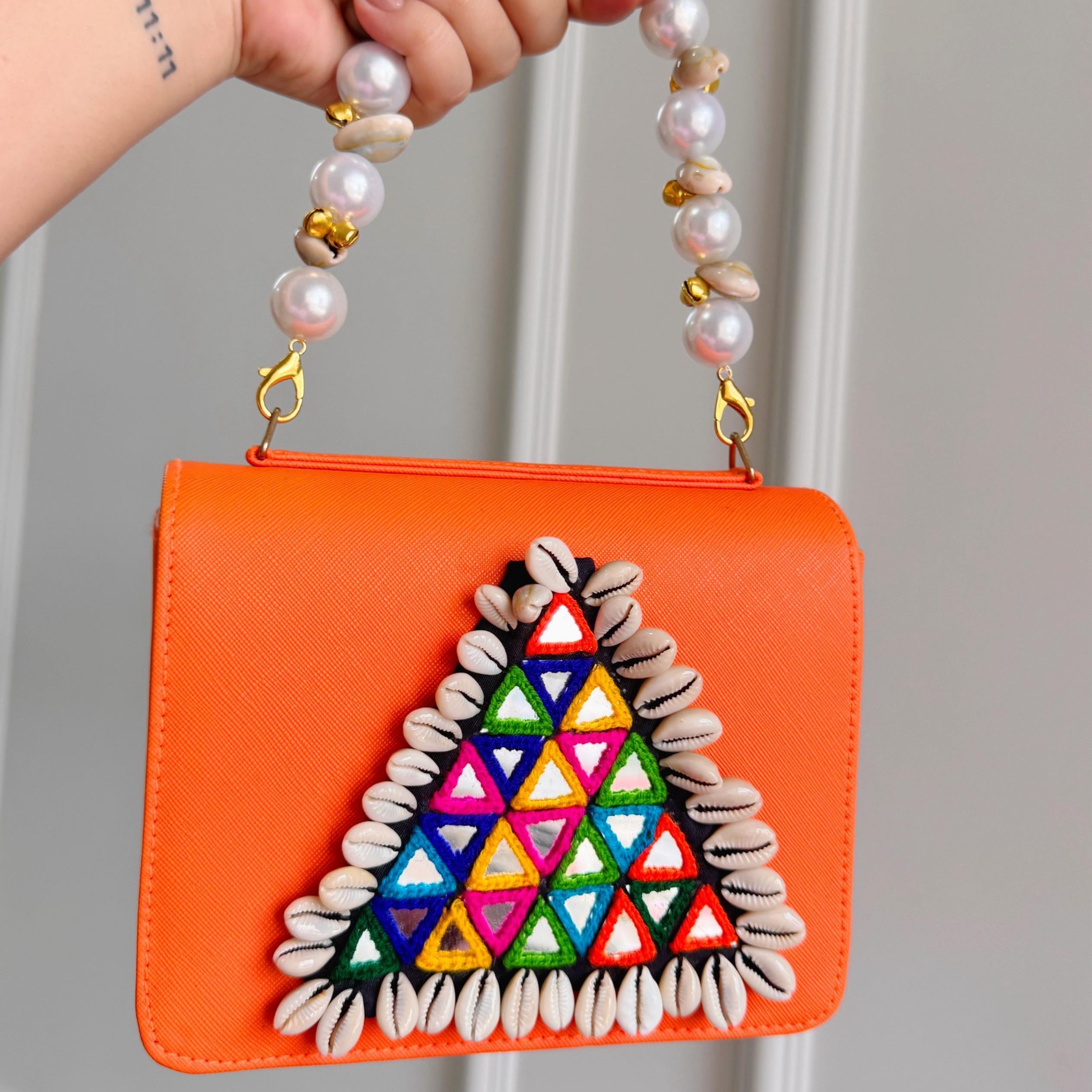 Designer Navratri Special Handcrafted Macro Bag – Multi-Mirror Embroidery, Cowrie Shell Edging & Pearl Handle Sling