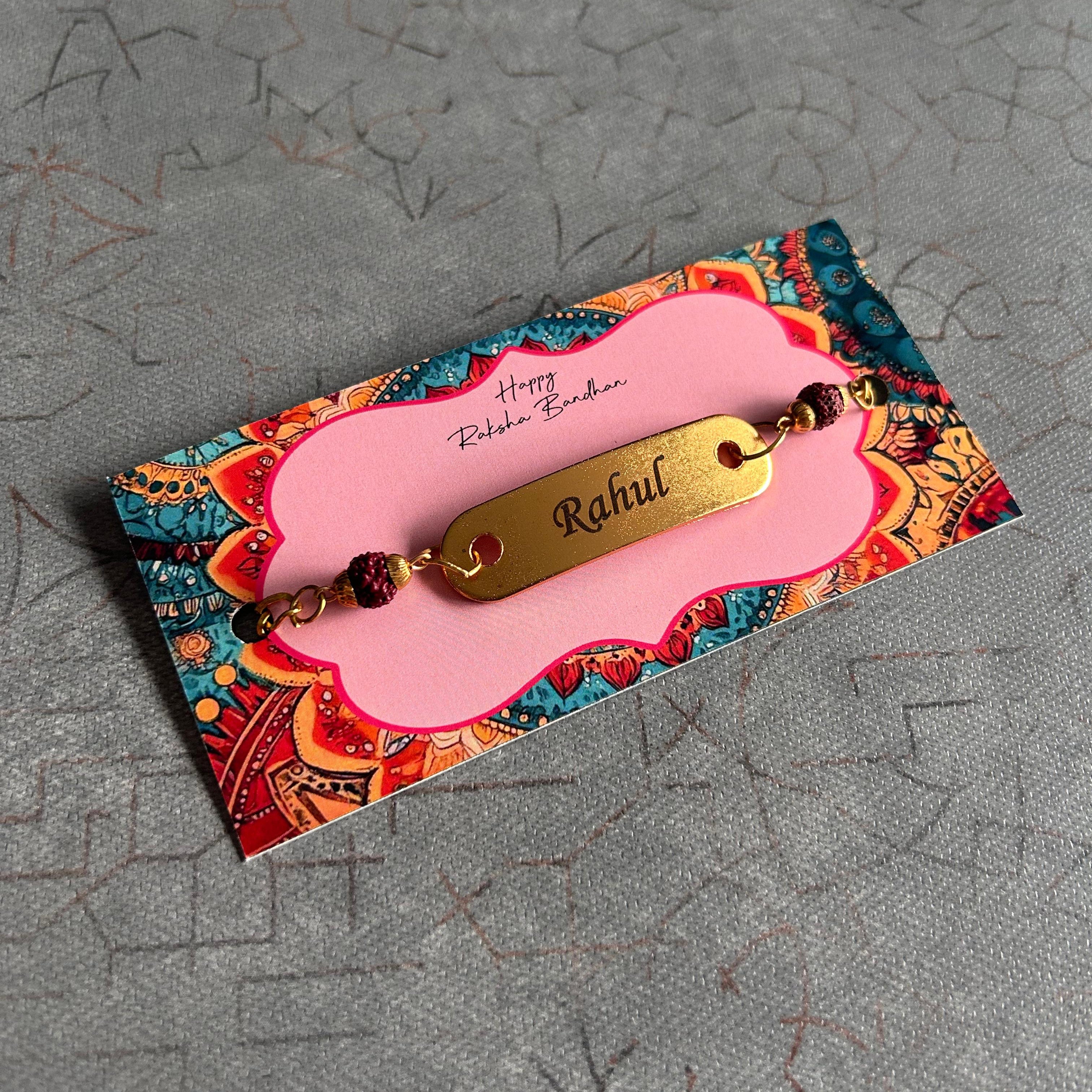 Decorative card with a gold name tag on a textured gray background - The Gifting Era