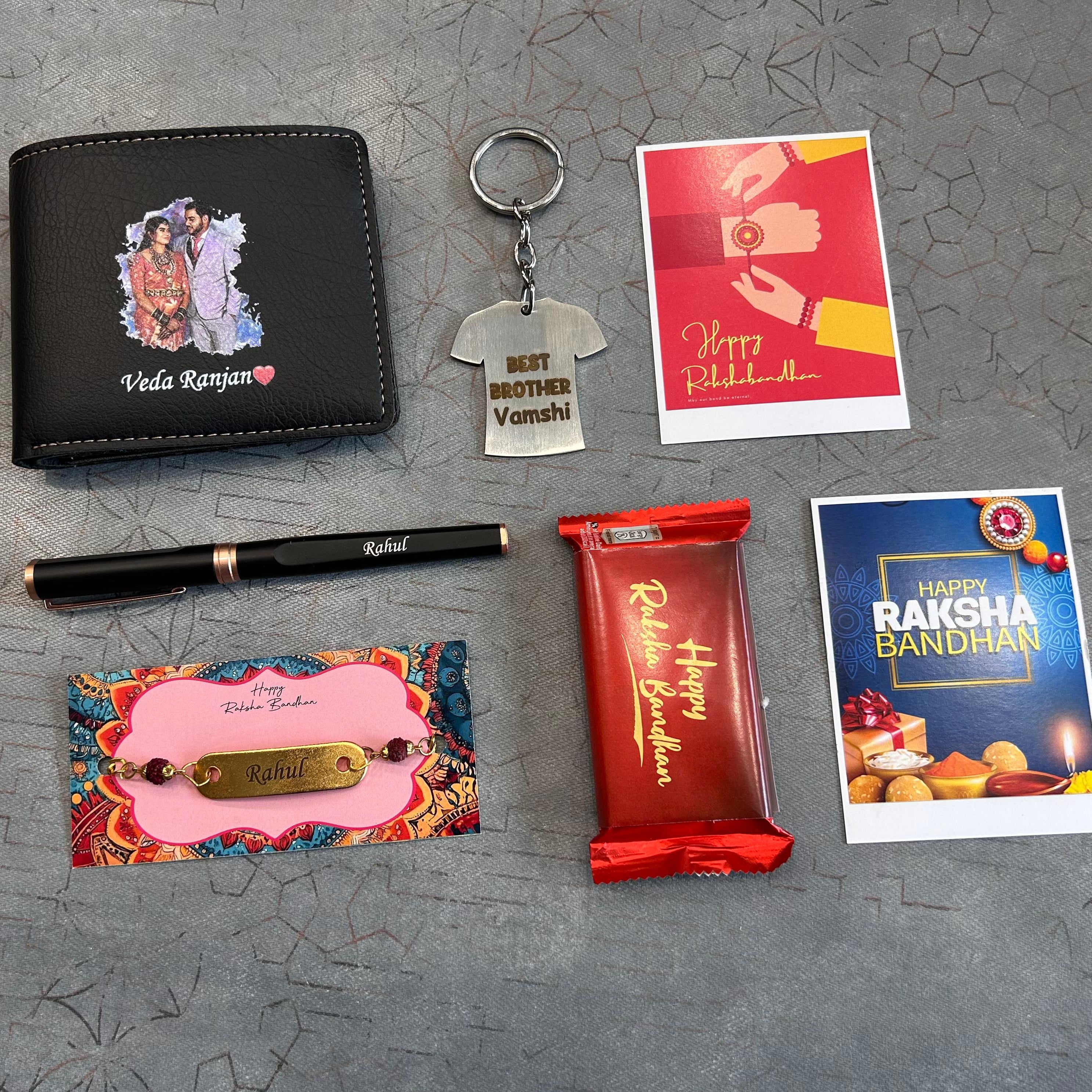 Collection of Raksha Bandhan-themed items including a wallet, keychain, pen, card, and candy on a textured surface. - The Gifting Era