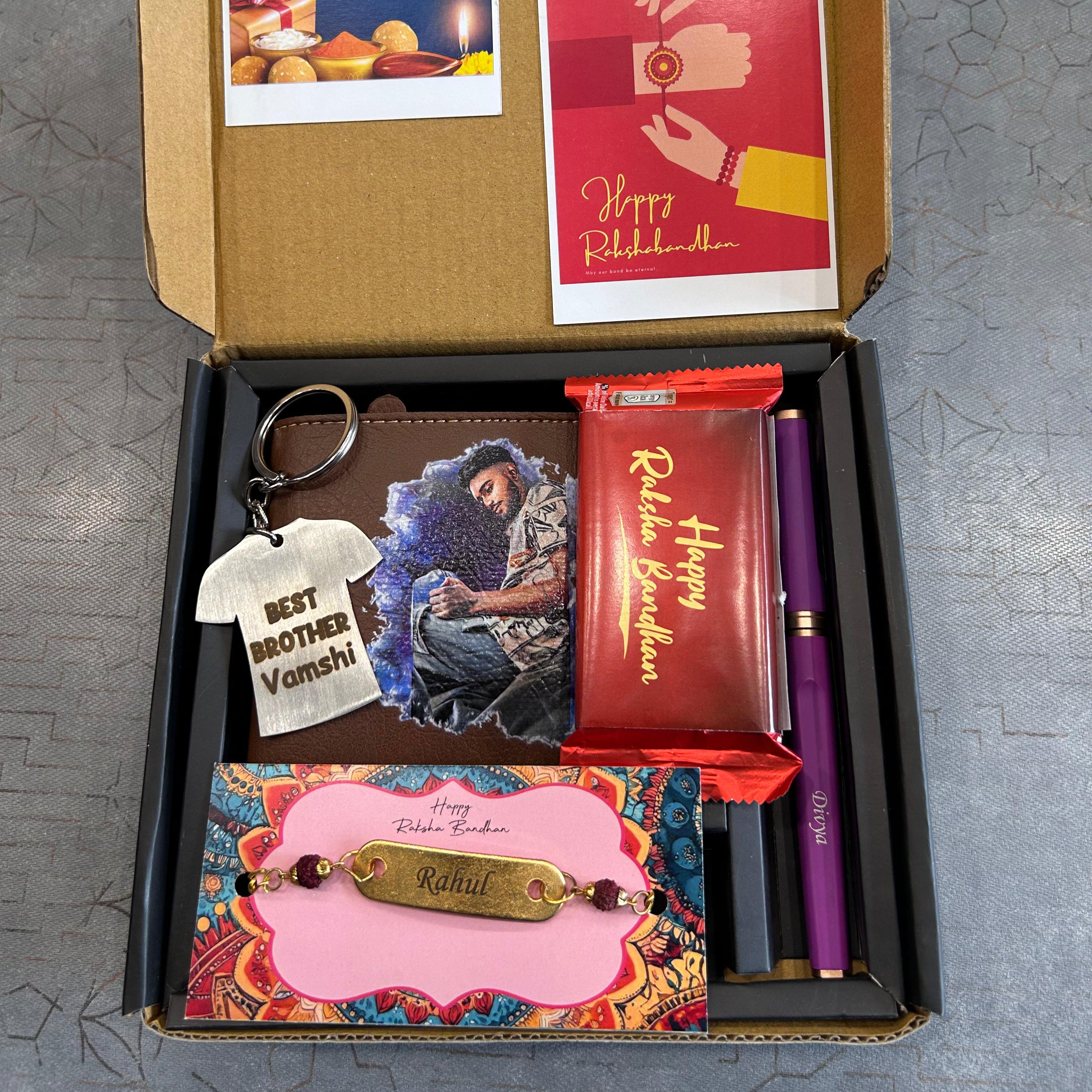 Gift box with Raksha Bandhan-themed items including a keychain, photo frame, and card. - The Gifting Era