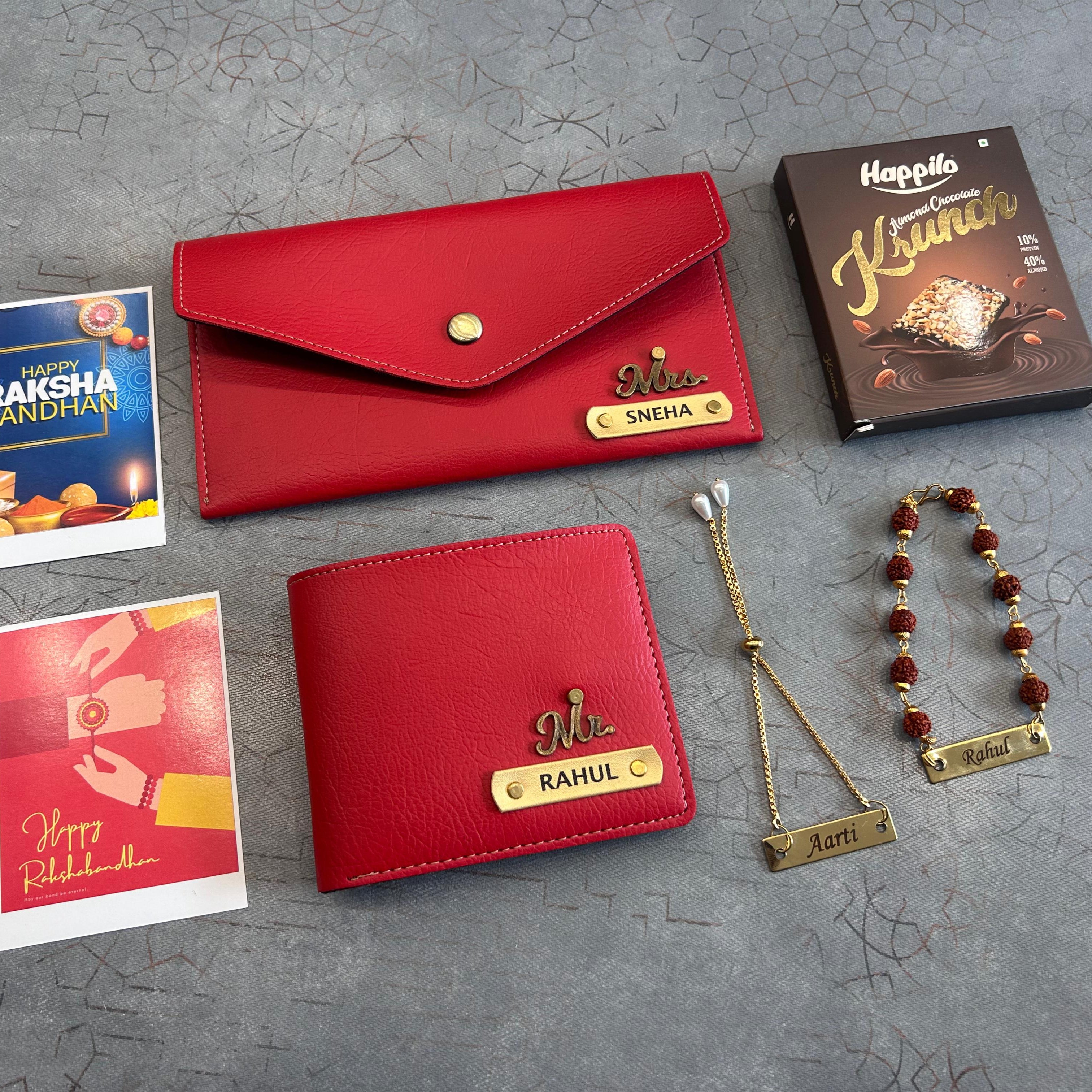 Red wallets, cards, chocolate, and jewelry on a gray surface - The Gifting Era
