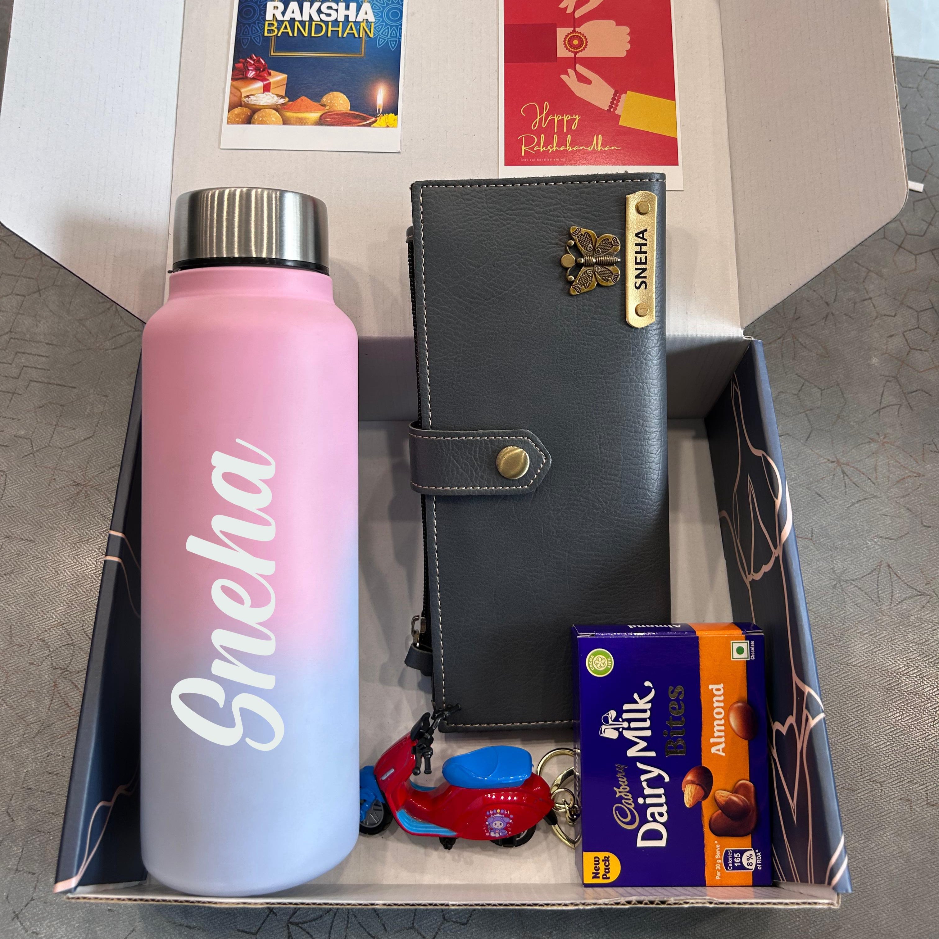 Gift set with pink water bottle, wallet, and Cadbury Dairy Milk chocolate in a box - The Gifting Era