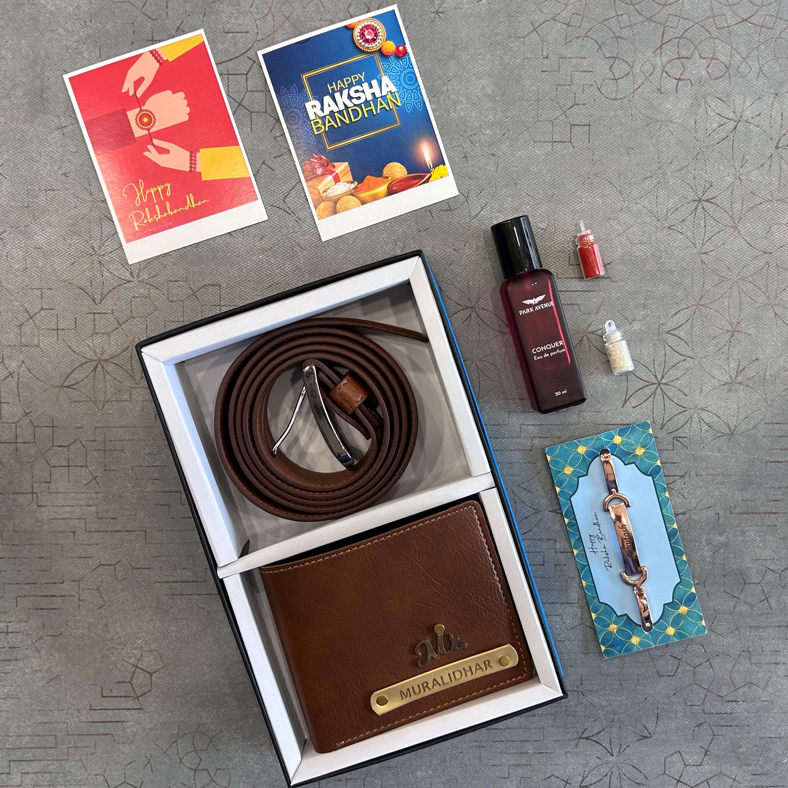 Brown leather belt and wallet set with small bottles and cards on a textured surface - The Gifting Era