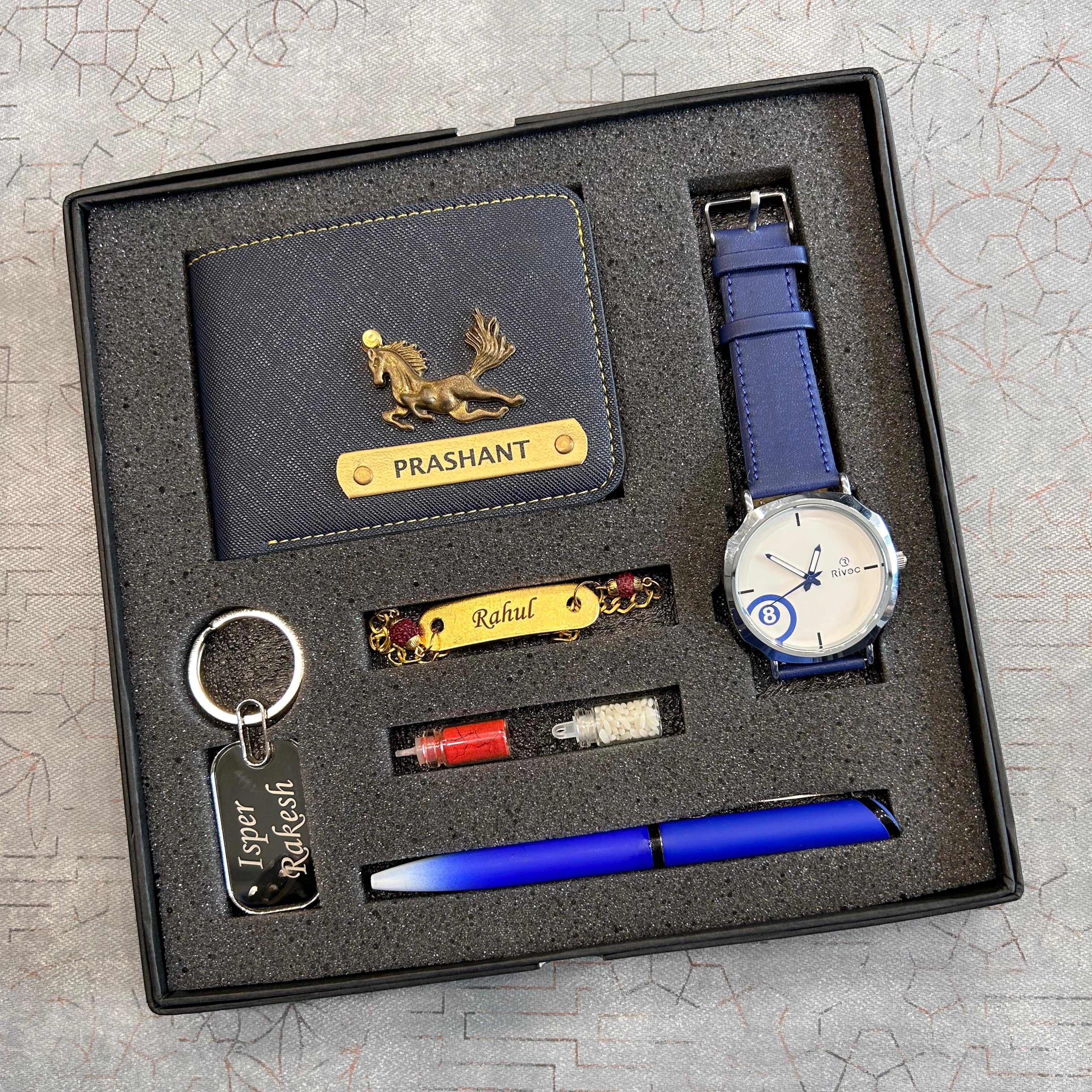 Gift set with wallet, watch, pen, keychain, and lighter in a box on a textured surface.  The Gifting Era