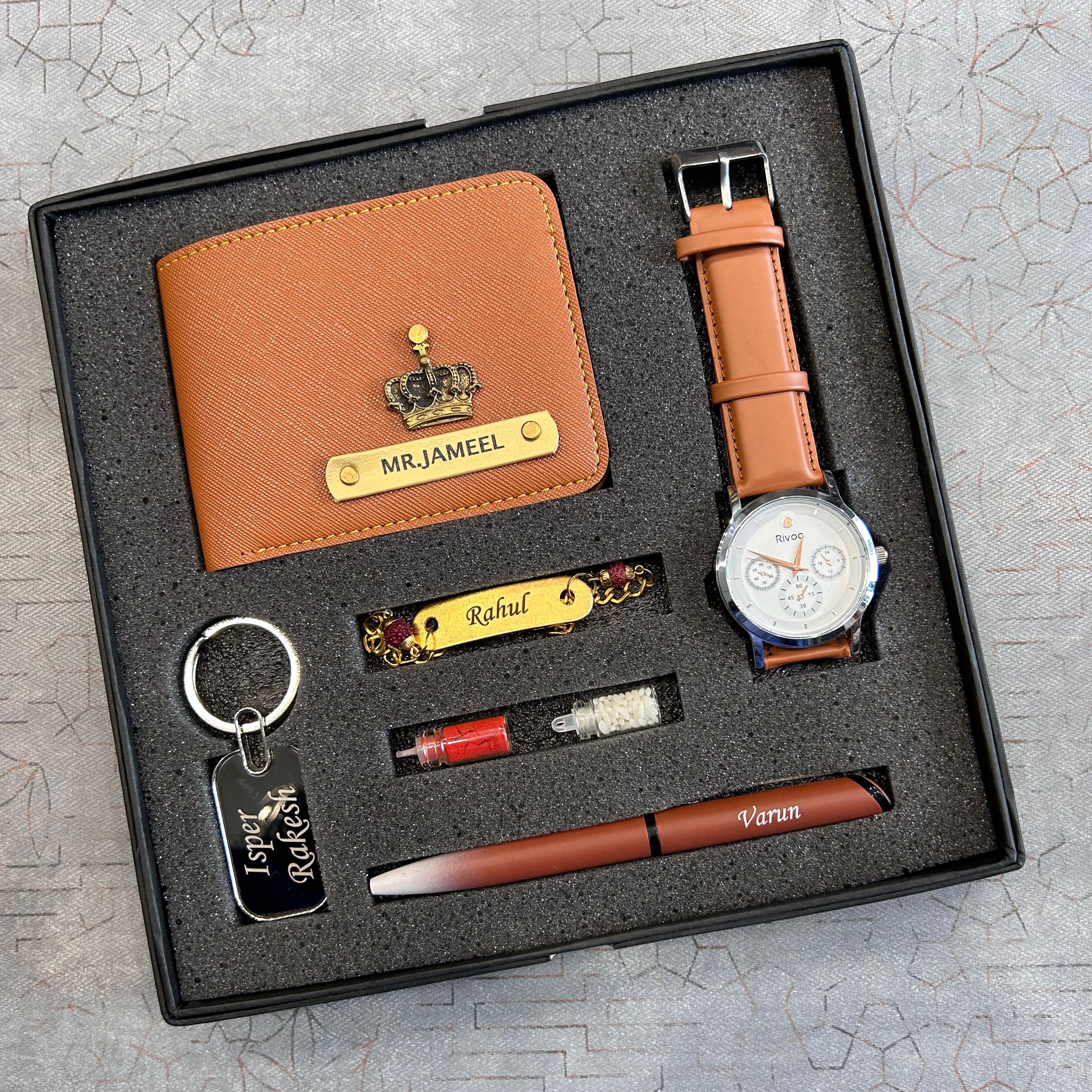 Gift set with wallet, watch, pen, keychain, and lighter on a textured surface - The Gifting Era