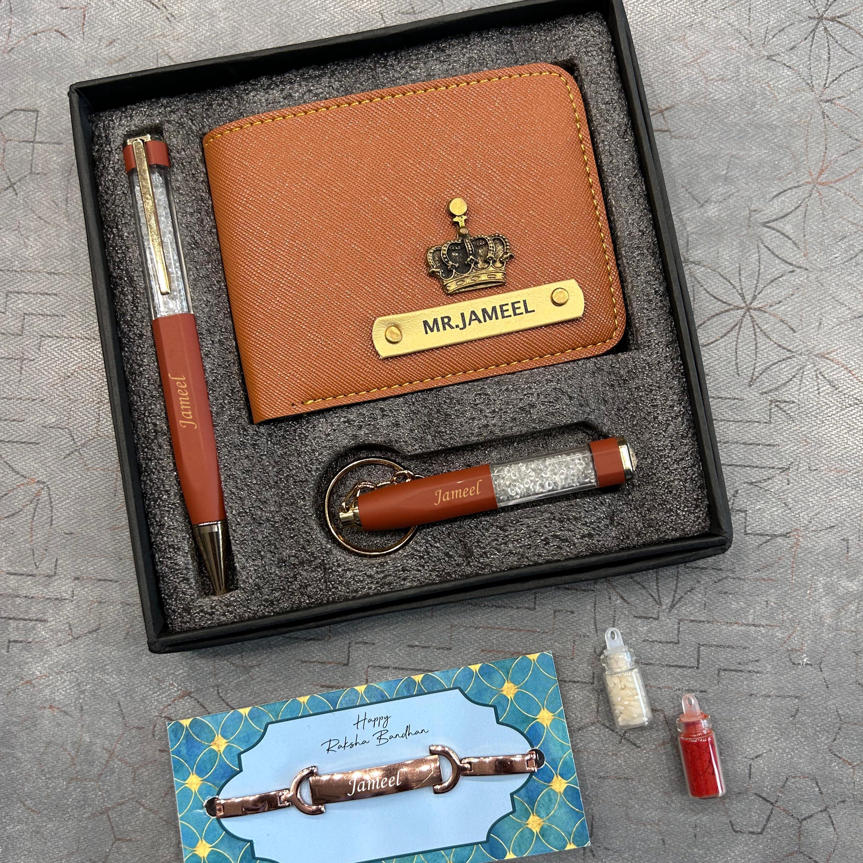 Gift set with brown leather wallet, pen, keychain, and card on a textured surface - The Gifting Era
