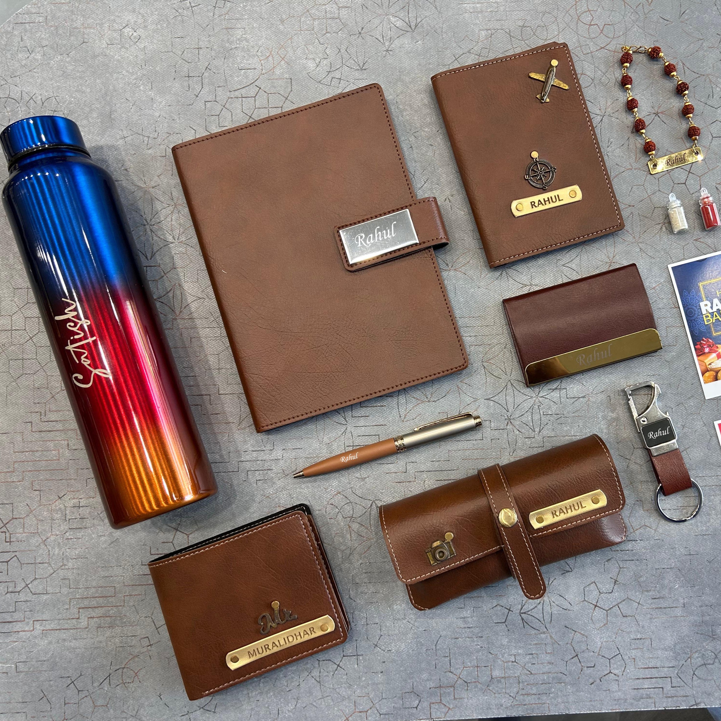 Collection of brown leather products and a colorful water bottle on a textured surface - The Gifting Era