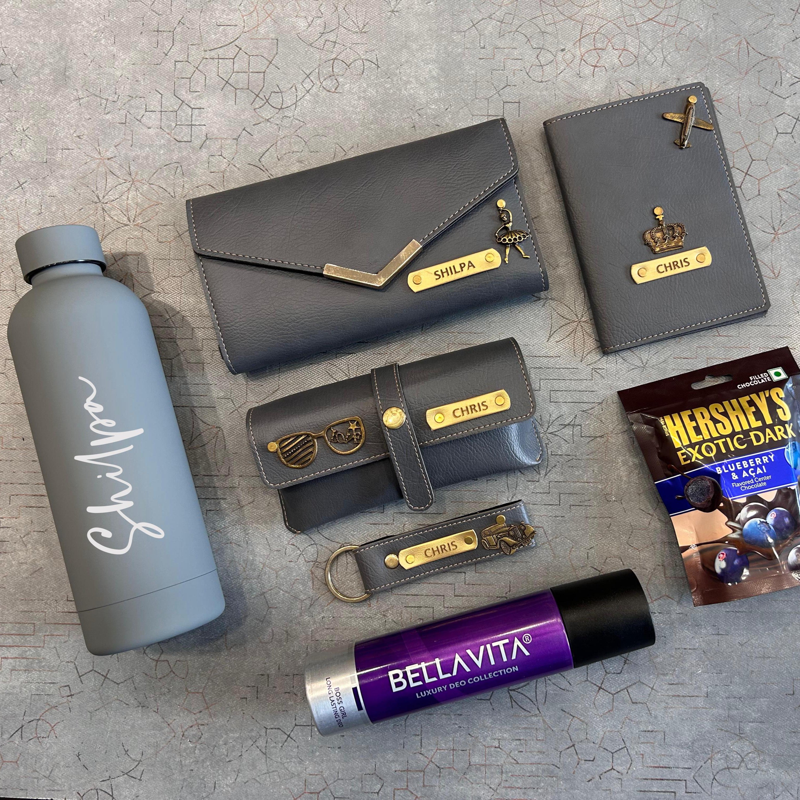 Collection of gray and purple products on a textured surface  - The Gifting Era
