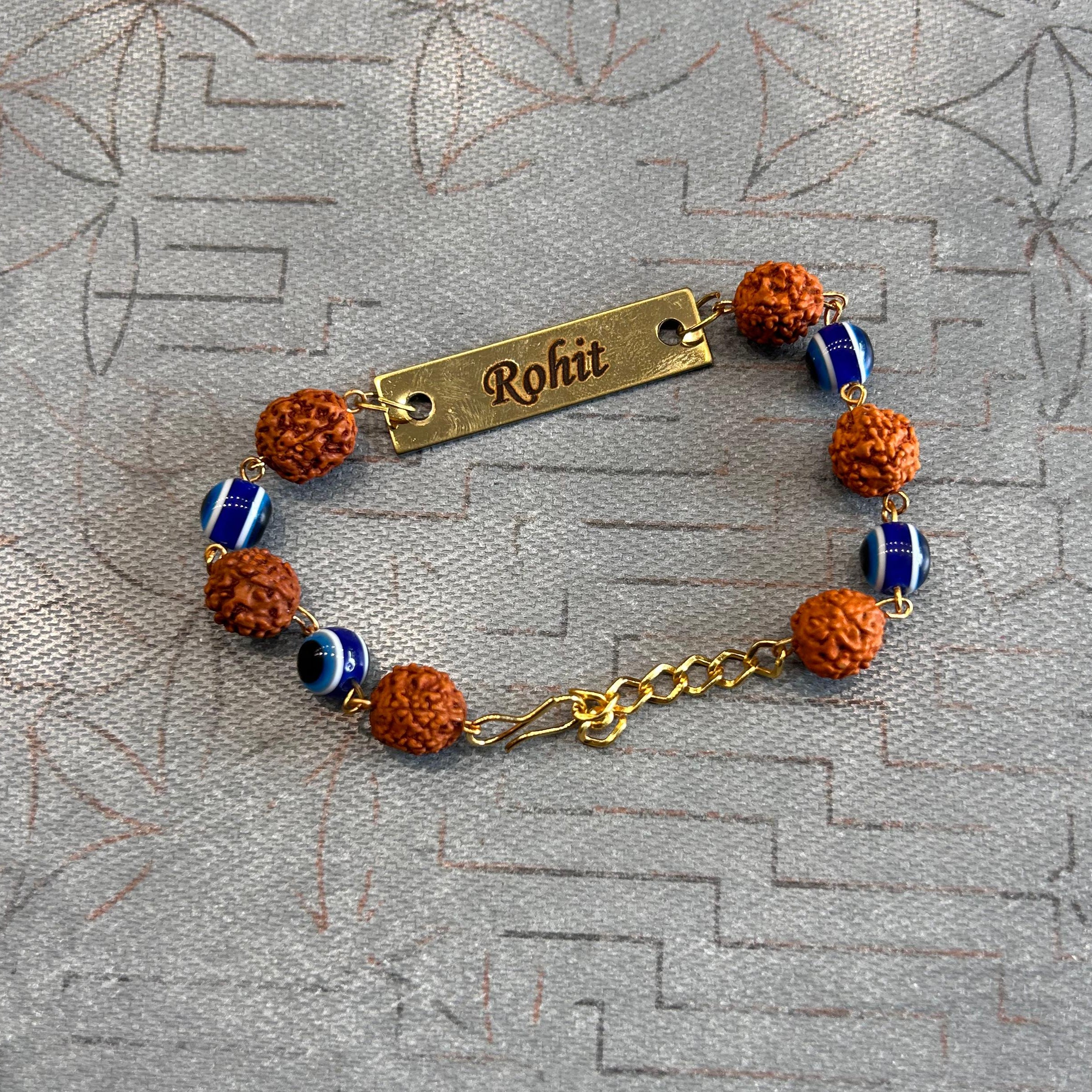 Bracelet with personalized name tag on a textured surface - The Gifting Era