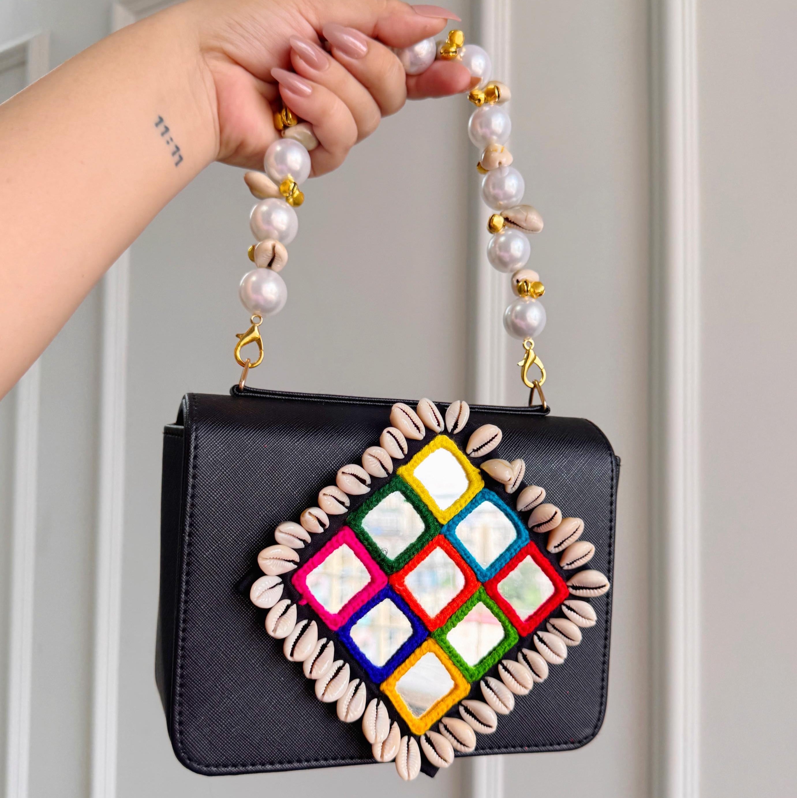 Designer Navratri Special Handcrafted Macro Bag – Multi-Mirror Embroidery, Cowrie Shell Edging & Pearl Handle Sling