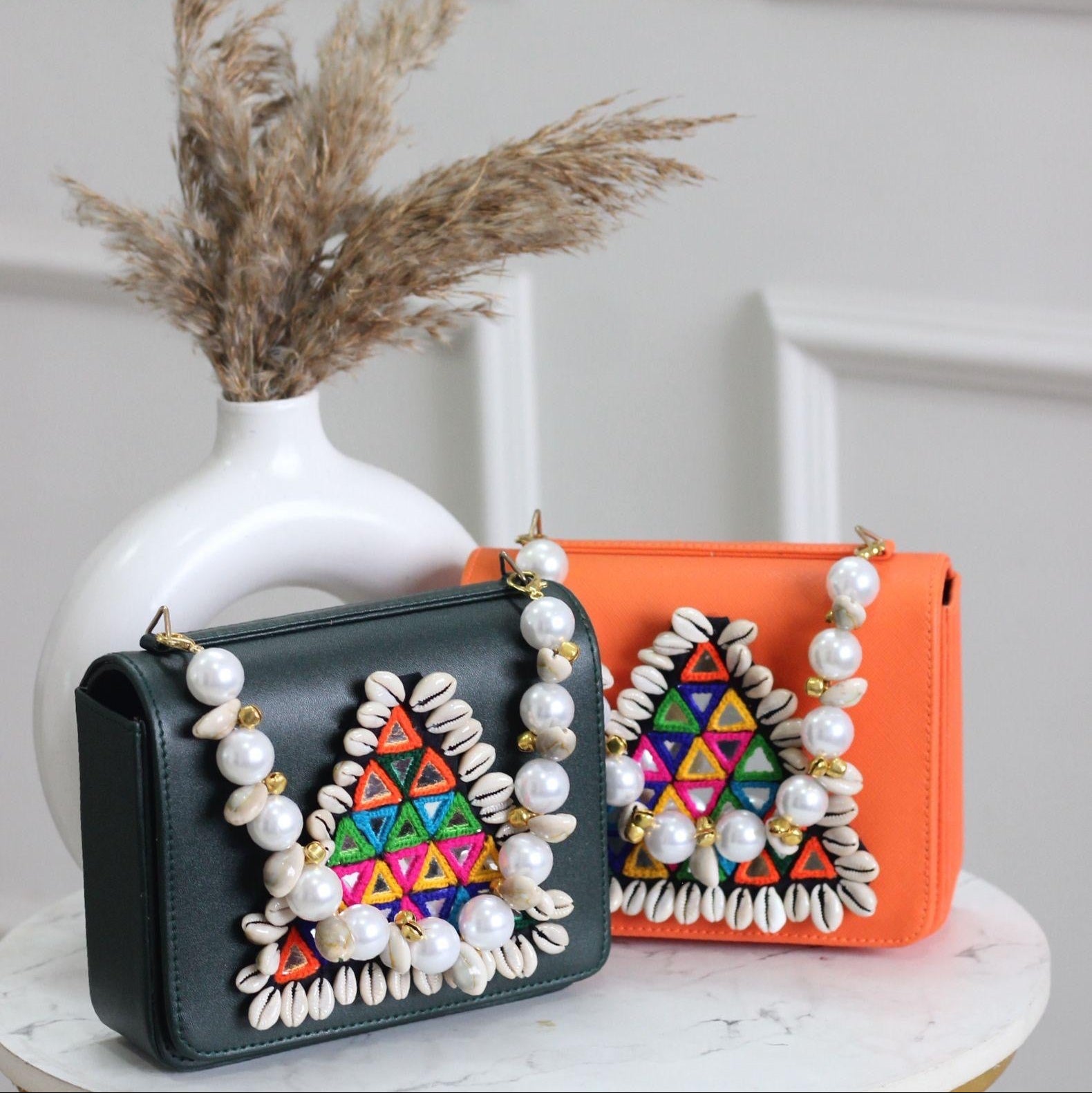 Designer Navratri Special Handcrafted Macro Bag – Multi-Mirror Embroidery, Cowrie Shell Edging & Pearl Handle Sling