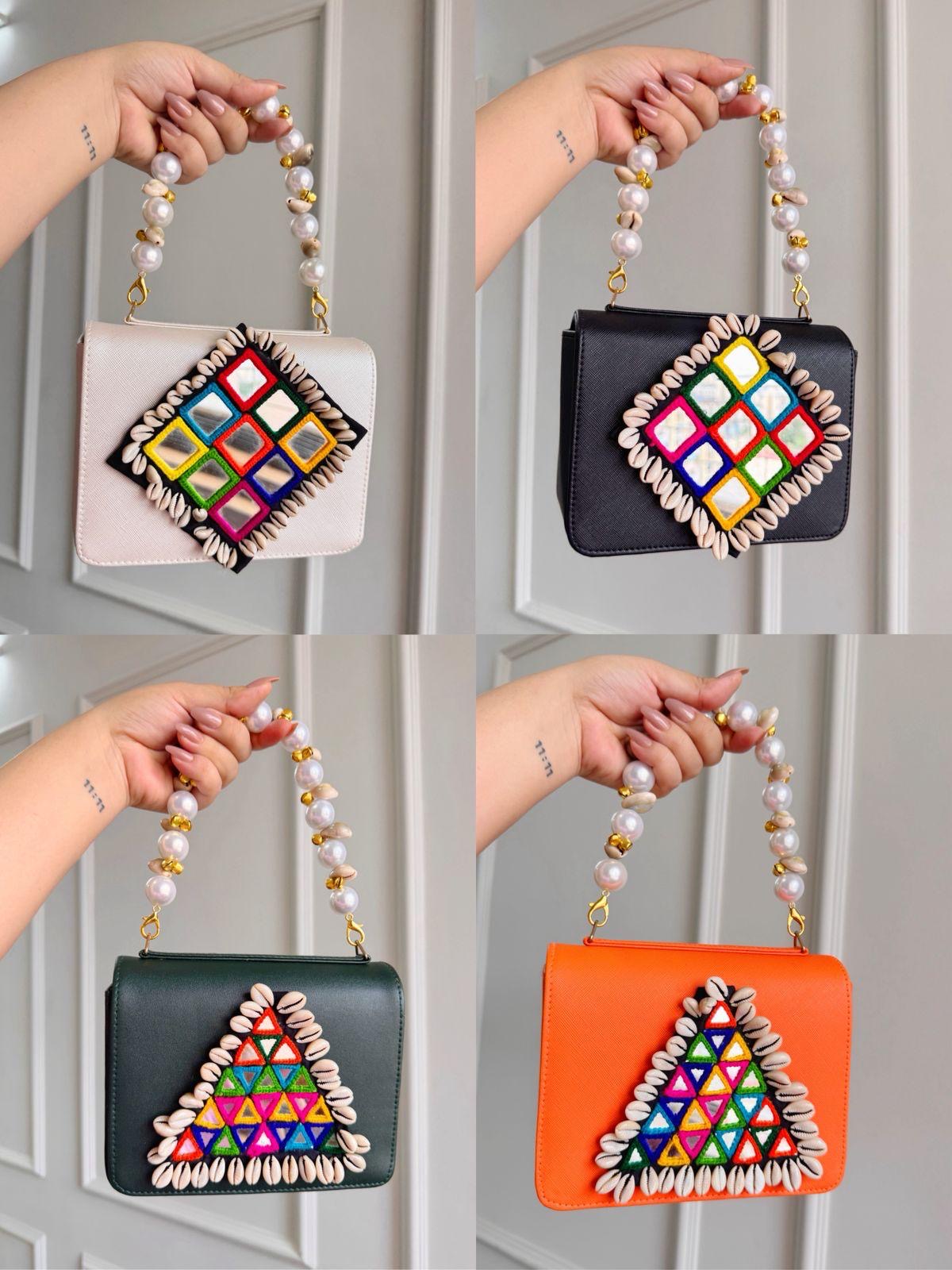 Designer Navratri Special Handcrafted Macro Bag – Multi-Mirror Embroidery, Cowrie Shell Edging & Pearl Handle Sling