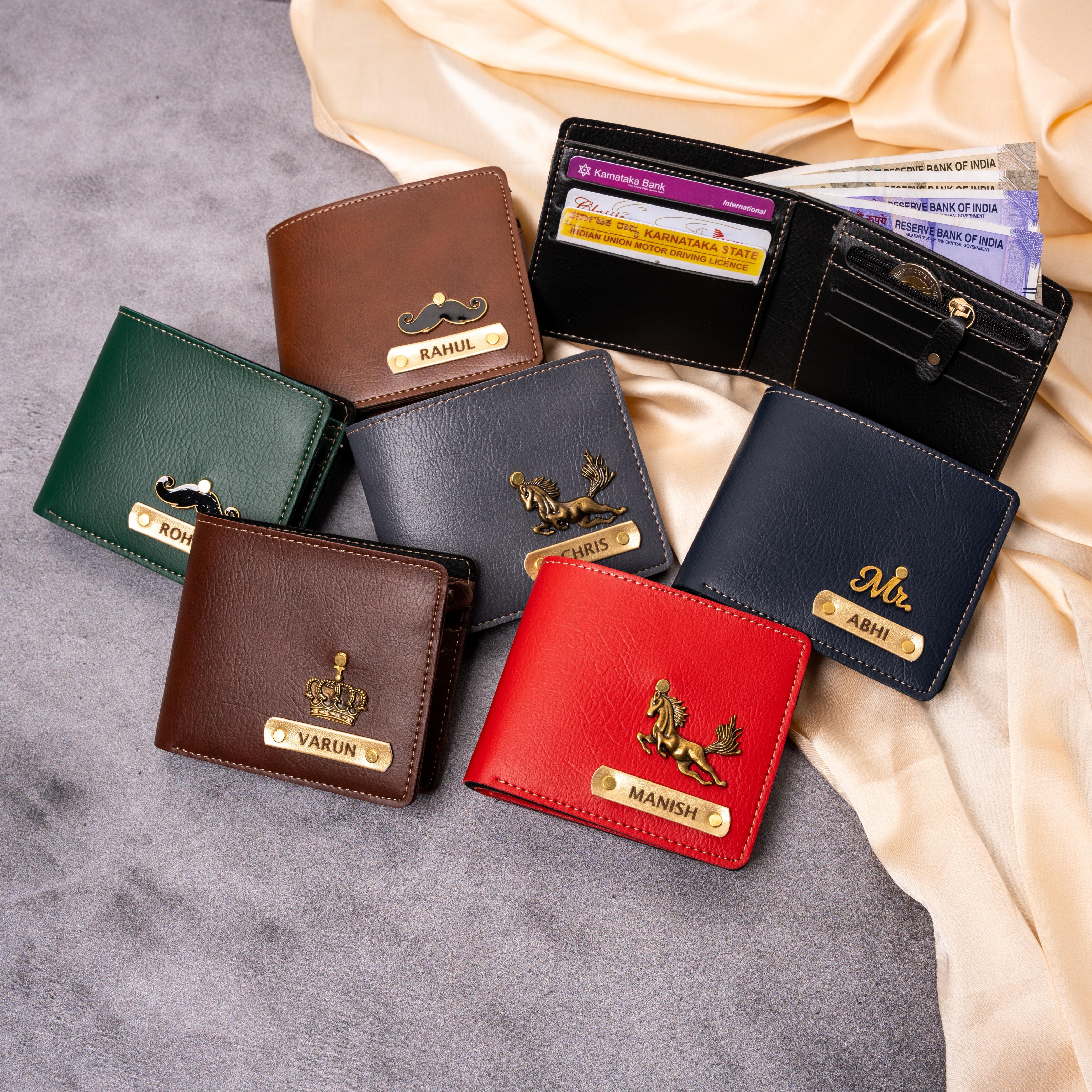 Collection of leather wallets with brand names on a gray surface
