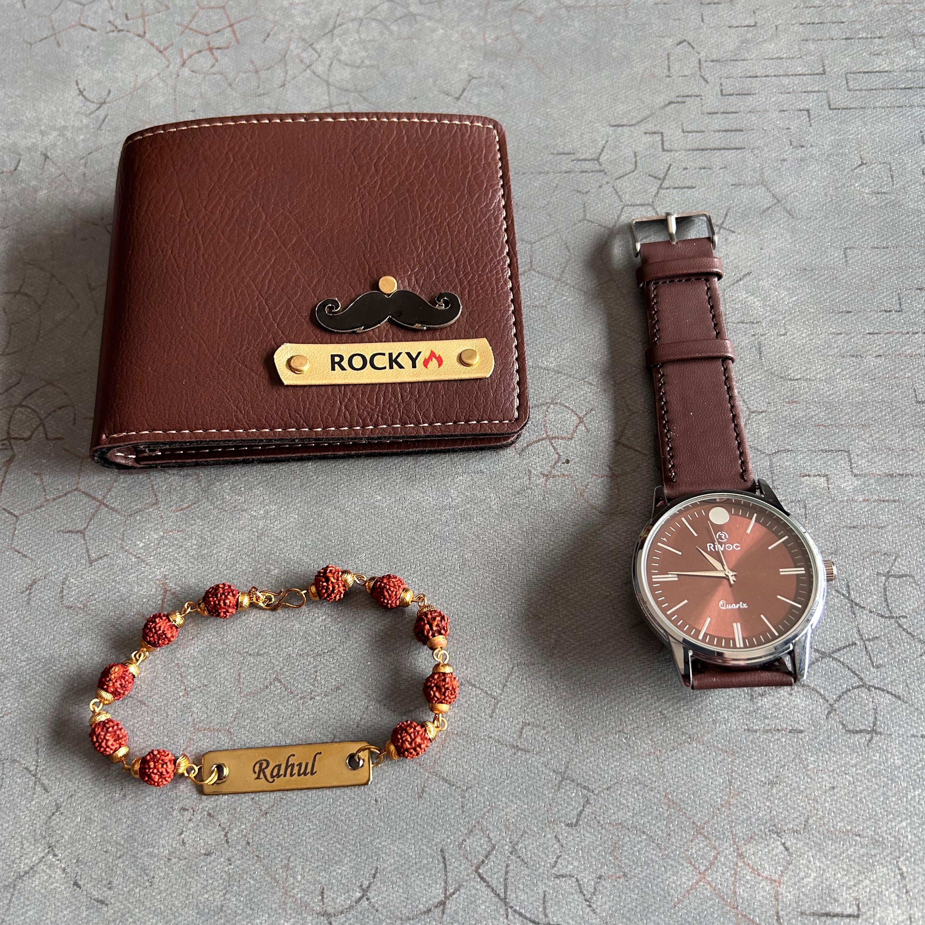 Brown leather wallet, watch, and bracelet on a textured gray surface