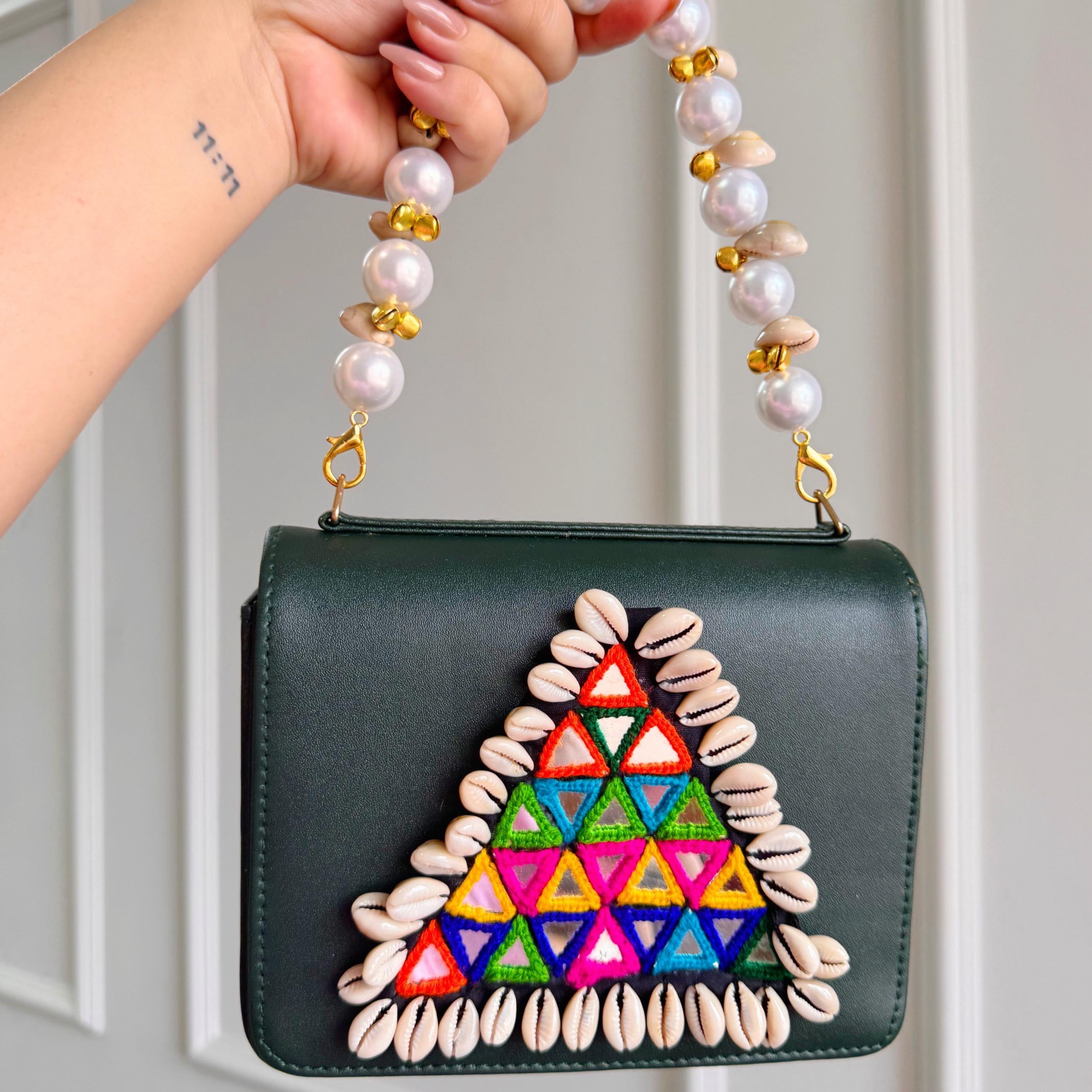 Designer Navratri Special Handcrafted Macro Bag – Multi-Mirror Embroidery, Cowrie Shell Edging & Pearl Handle Sling