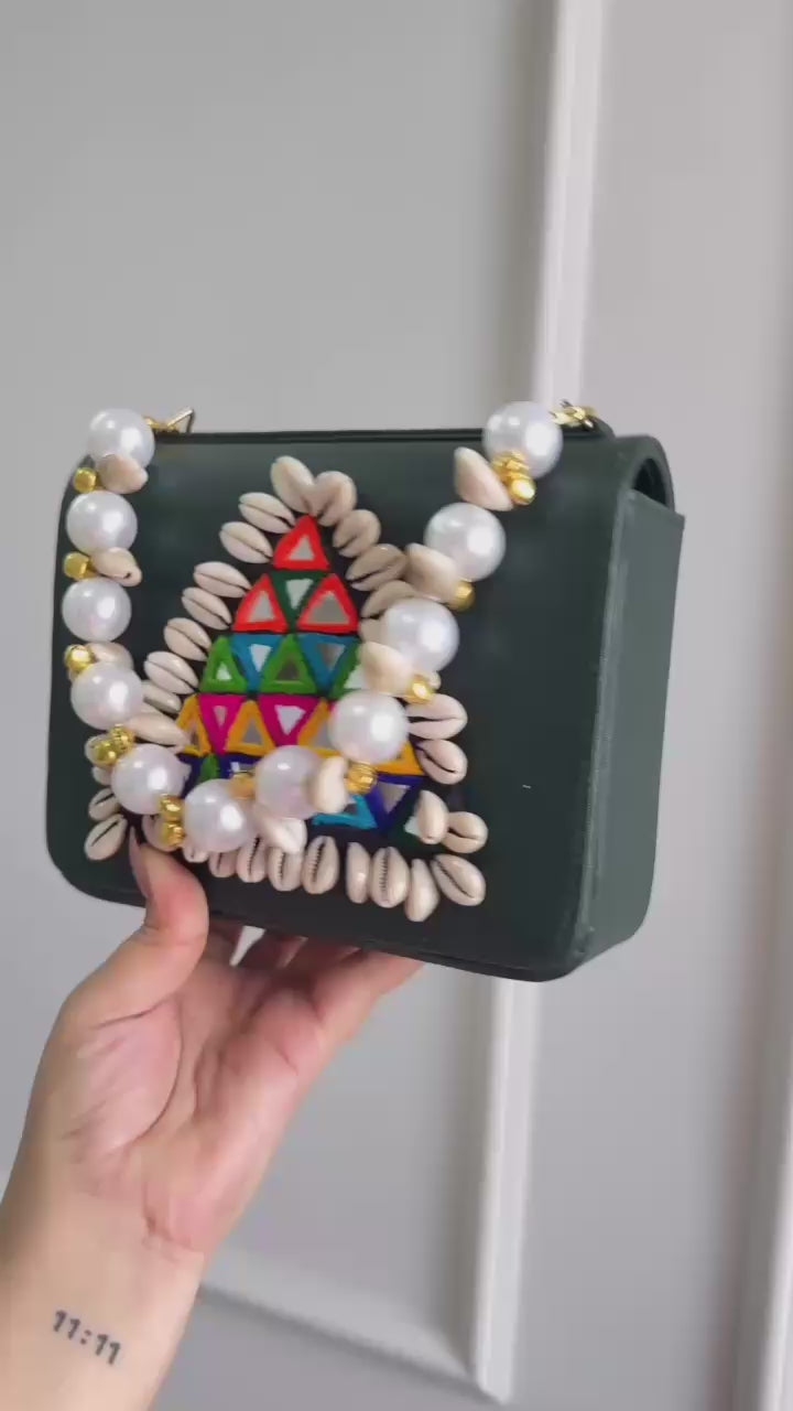 Designer Navratri Special Handcrafted Macro Bag – Multi-Mirror Embroidery, Cowrie Shell Edging & Pearl Handle Sling